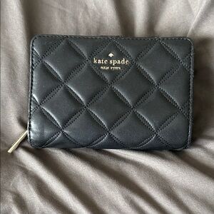 Kate Spade black quilted bi-fold wallet … previously loved.  🖤